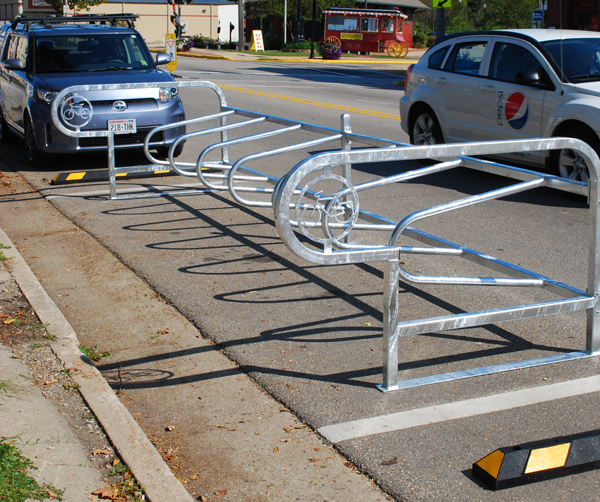 A bicycle corral in a single unit. 