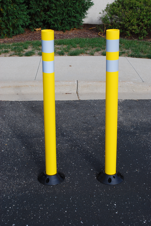 Yellow bike corral delineators.